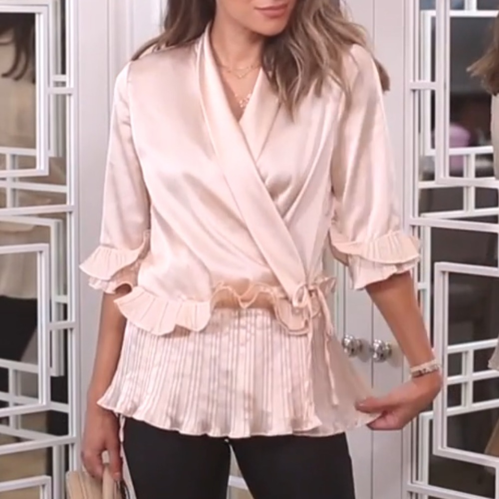 Satin wrap blouse with ruffled hem